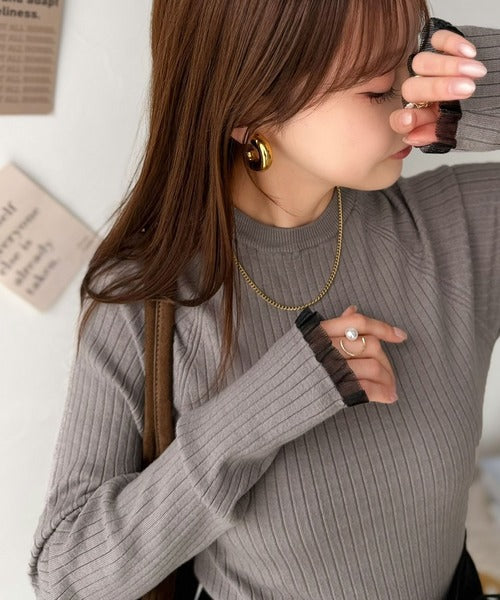 甘さは袖口に、大人可愛いさはさりげなく。配色ラグラン袖シアーフリル使いリブニットトップス ce1380019