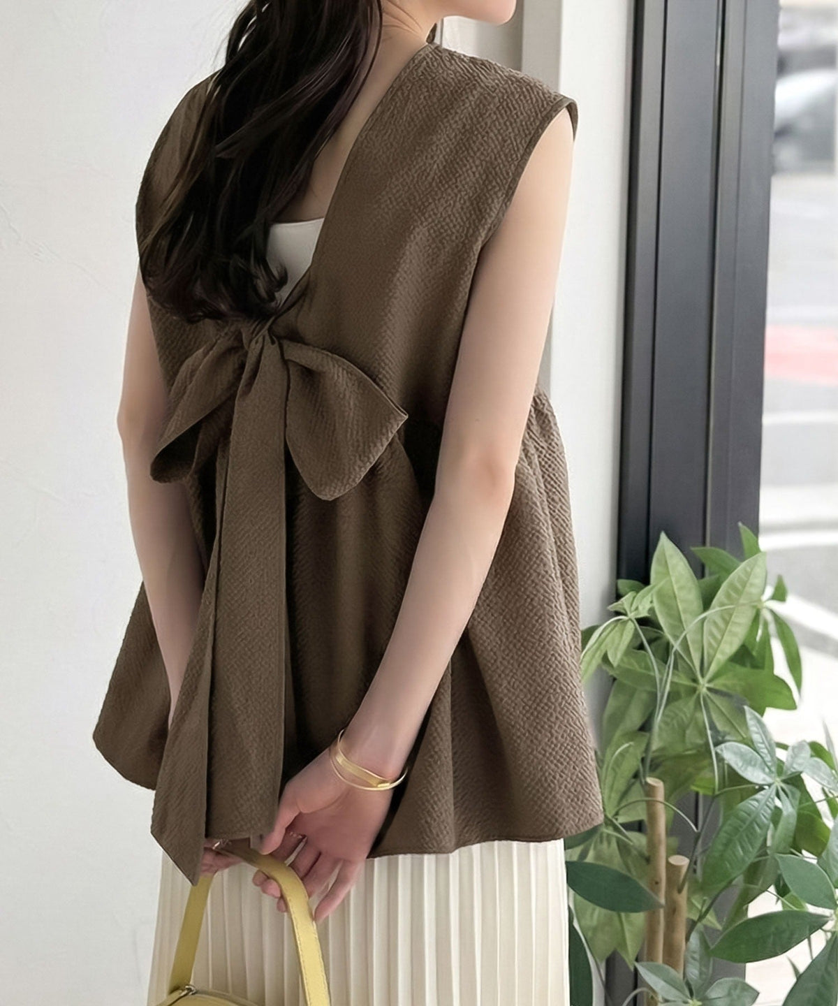 バックリボンで華やぐ１枚。ウエスト切り替えで自然にスタイルアップ♪ バックリボンペプラムトップス ce1110179