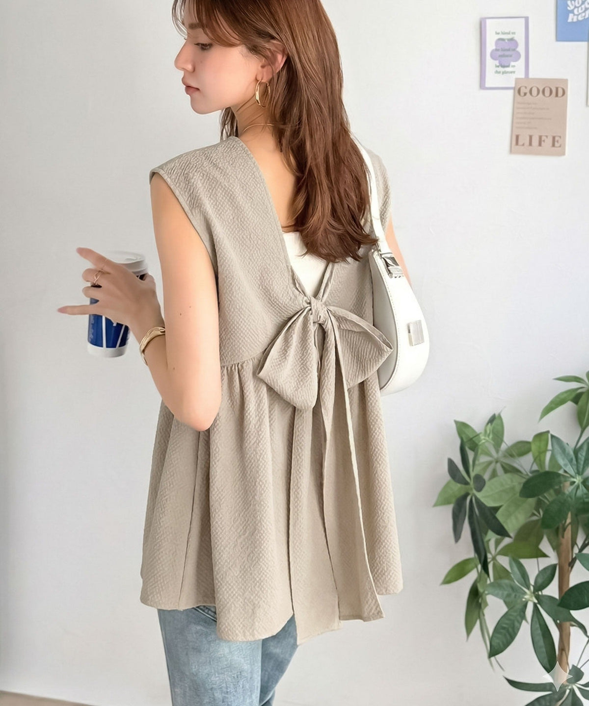 バックリボンで華やぐ１枚。ウエスト切り替えで自然にスタイルアップ♪ バックリボンペプラムトップス ce1110179
